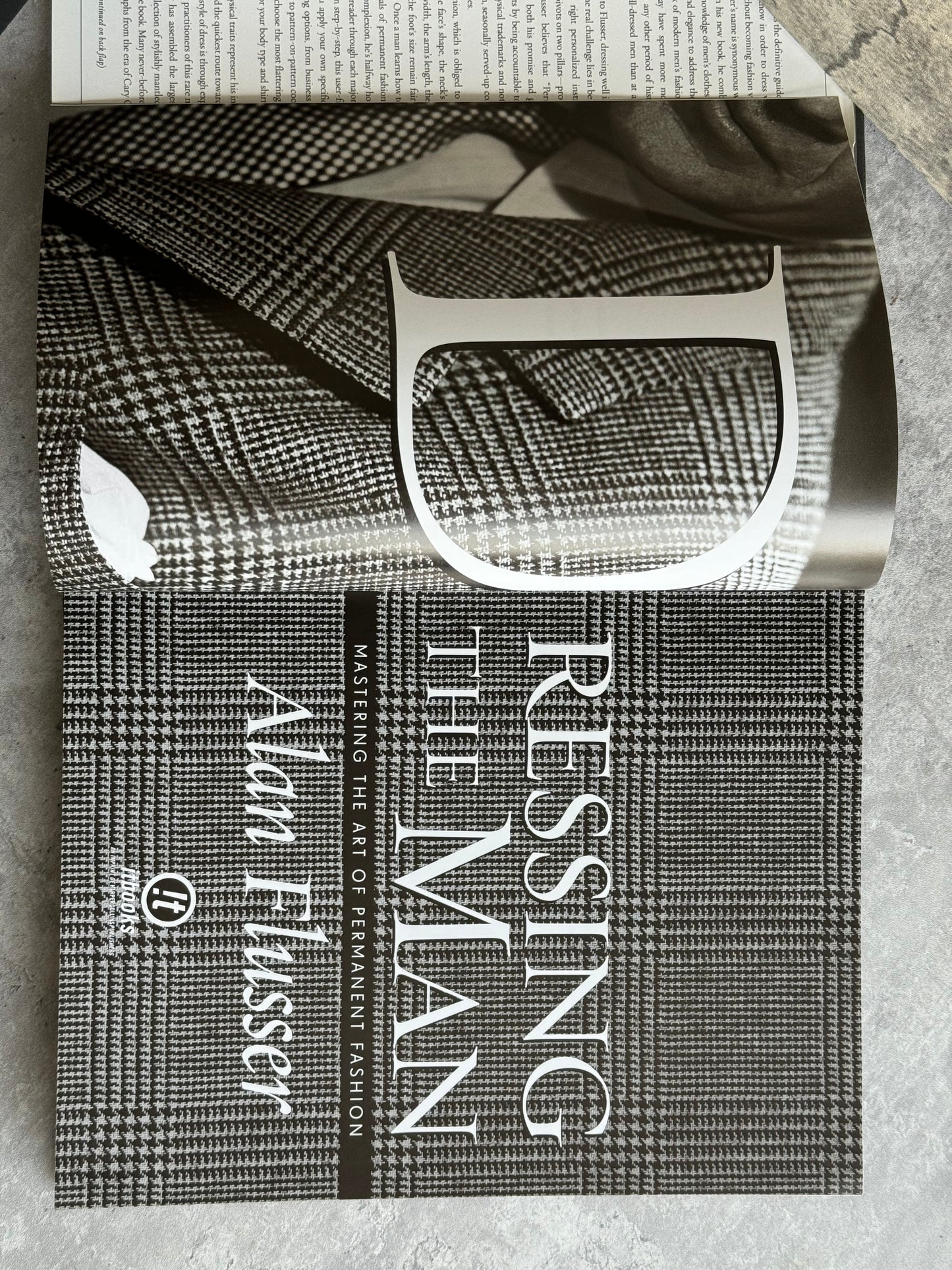 “Dressing the Man. Mastering the Art of Permanent Fashion” book by Alan Flusser.