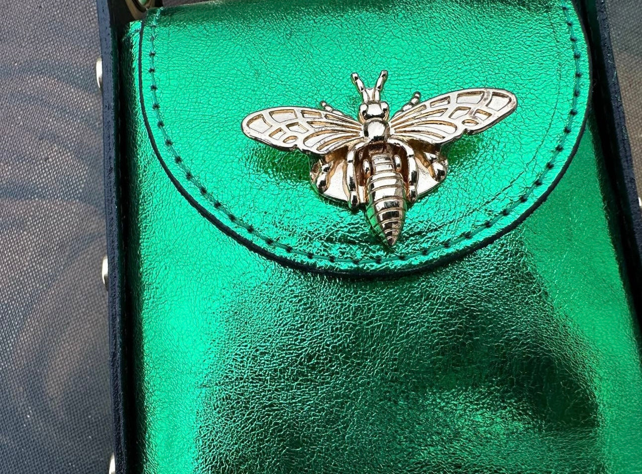 Green leather cell phone pouch.