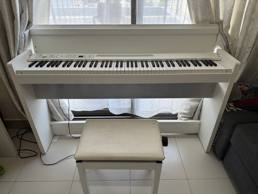 Korg Upright Electric Piano with the stool