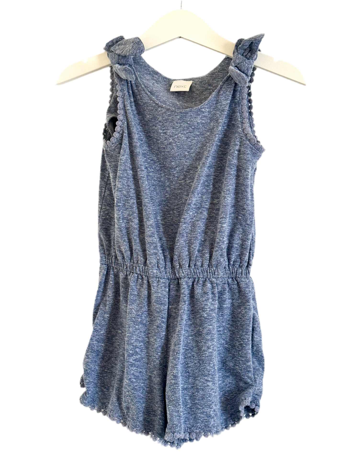 A pair of grey shoft dungarees for girls, displayed on a white hanger, with a tag indicating the size as 0000.
