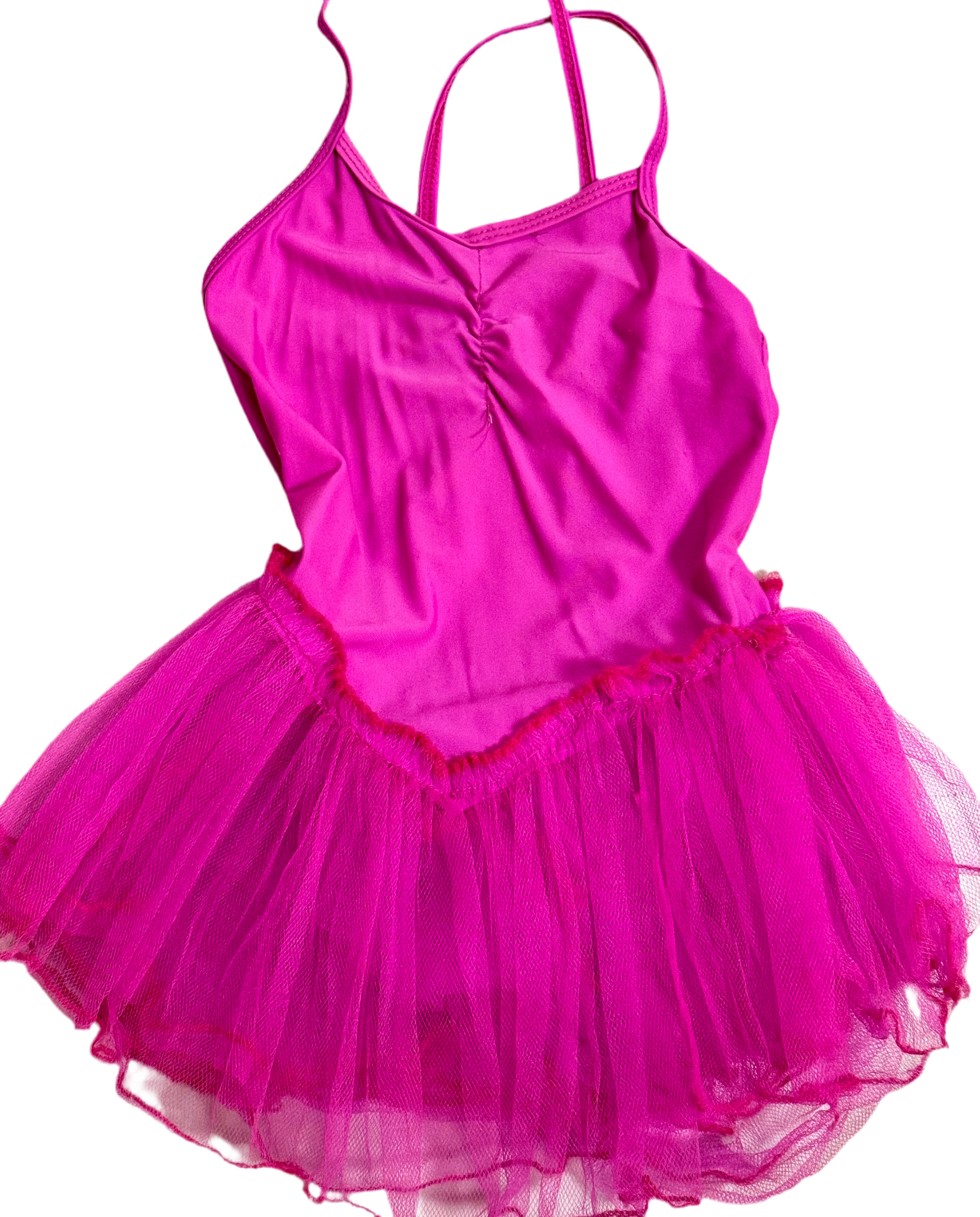 A pink gymnastic dress with short sleeves and a V-neck design, displayed against a white background.