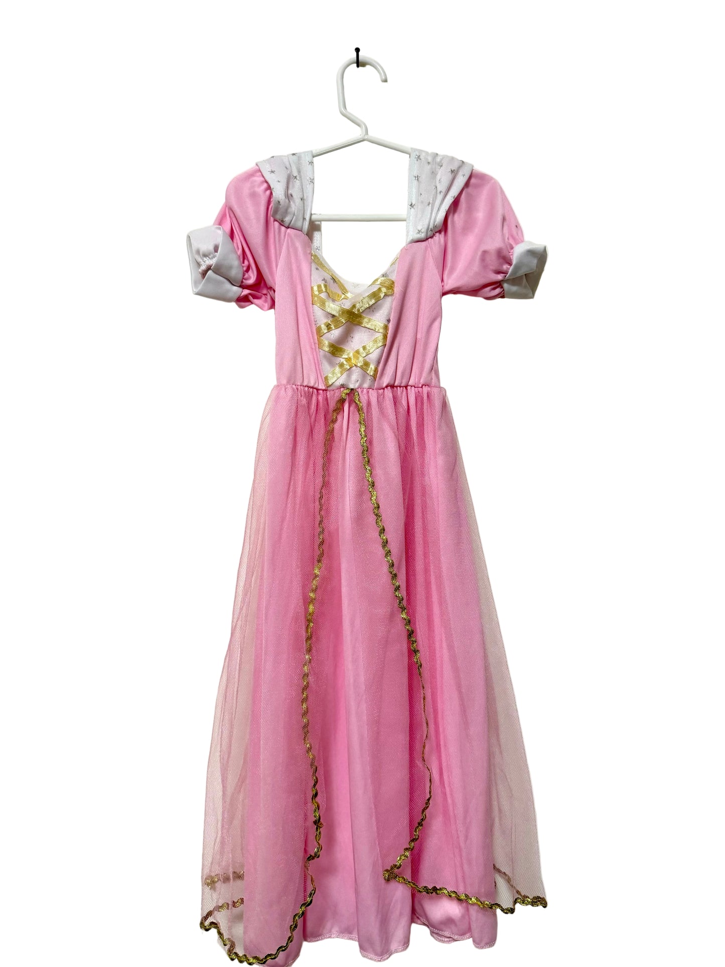 A pink dress with long sleeves, a necklace, and a headpiece hanging on a white hanger against a plain background.